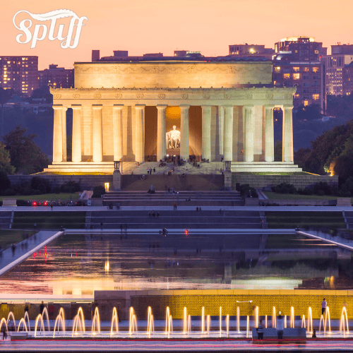 Lincoln Memorial at sunset in Los Angeles, CA, with illuminated fountain in foreground.